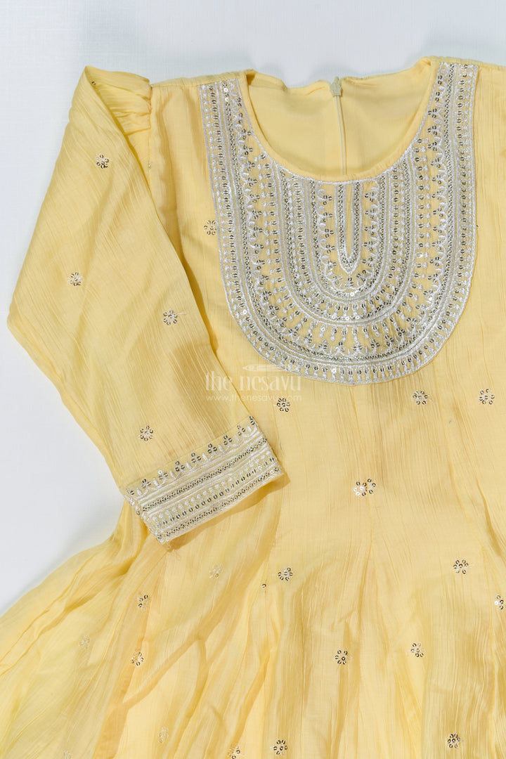 The Nesavu Girls Sharara / Plazo Set Girls Yellow Cotton Sharara Set with Silver Borders and Flared Sleeves for a Bright simple sharara suit Look Nesavu Nesavu Girls Yellow Cotton Sharara Set Silver Border Detailing simple sharara suit