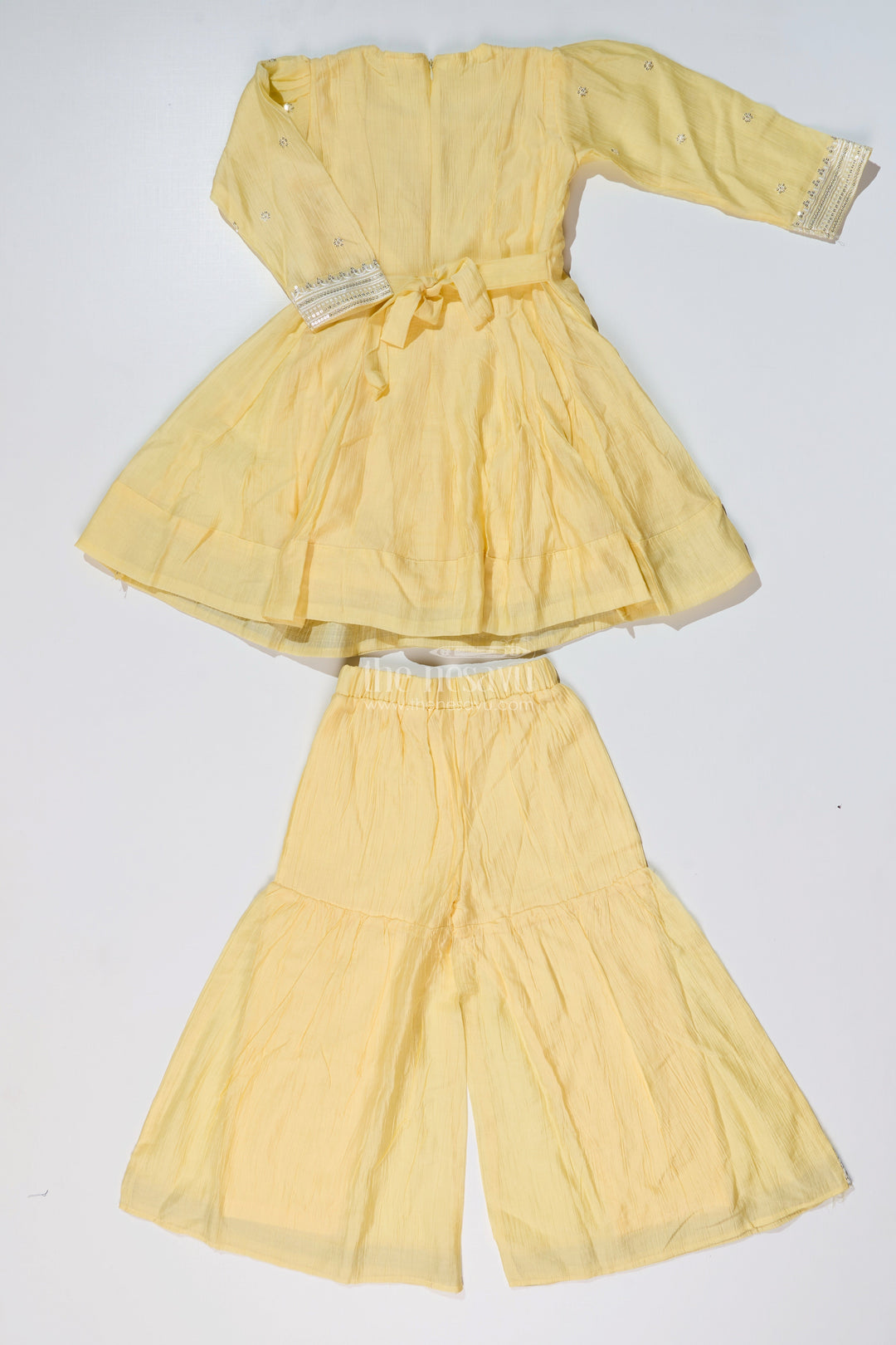 The Nesavu Girls Sharara / Plazo Set Girls Yellow Cotton Sharara Set with Silver Borders and Flared Sleeves for a Bright simple sharara suit Look Nesavu Nesavu Girls Yellow Cotton Sharara Set Silver Border Detailing simple sharara suit