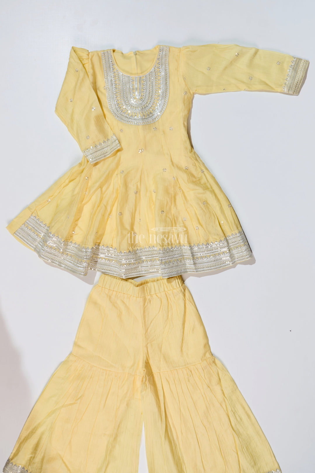 The Nesavu Girls Sharara / Plazo Set Girls Yellow Cotton Sharara Set with Silver Borders and Flared Sleeves for a Bright simple sharara suit Look Nesavu Nesavu Girls Yellow Cotton Sharara Set Silver Border Detailing simple sharara suit