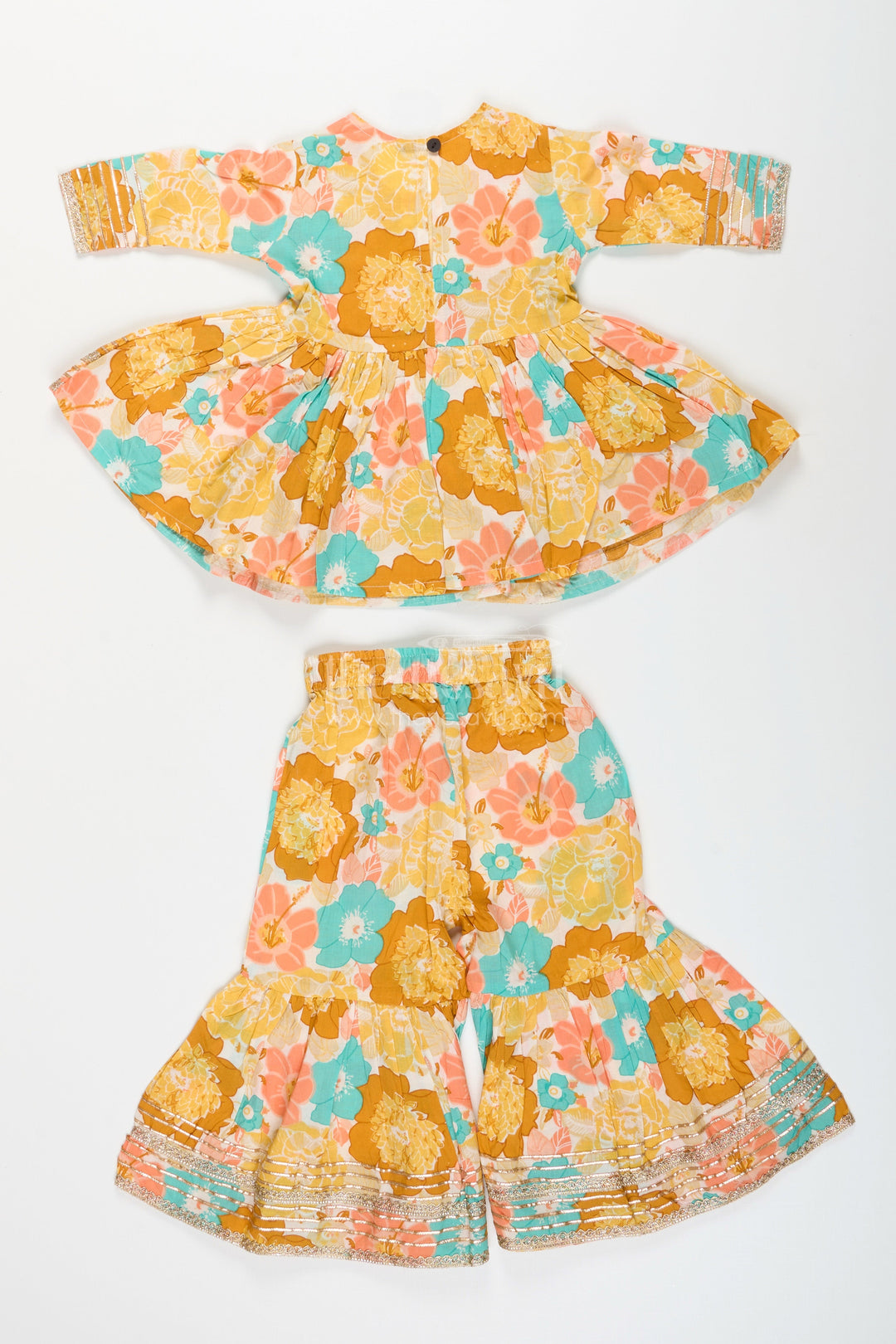 The Nesavu Girls yellow cotton sharara set with tassels and floral block print for ethnic days Nesavu Nesavu girls yellow cotton block print sharara set tassels  ethnic outfit school casual celebrations