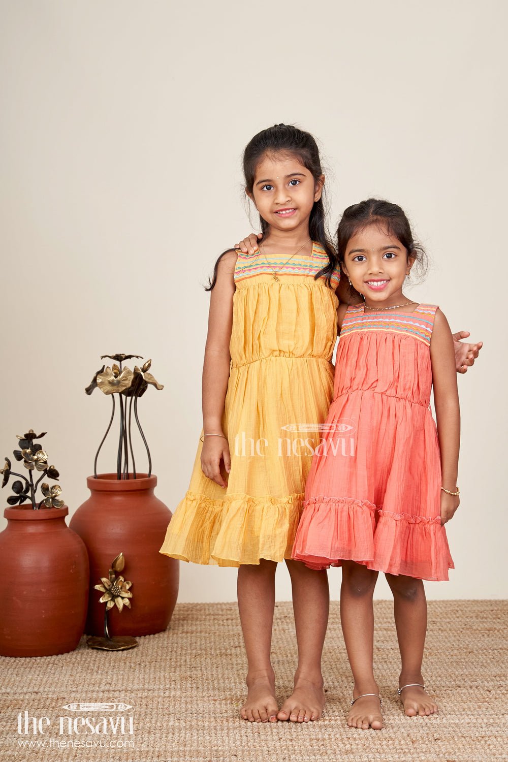 The Nesavu Girls Cotton Frock Girls Yellow Frocks Design with Popcorn Crush Cotton and Multicolor Embroidered Details Nesavu Nesavu Yellow Frocks Design Girls Thread Embroidery Soft Popcorn Crush Cotton Finish