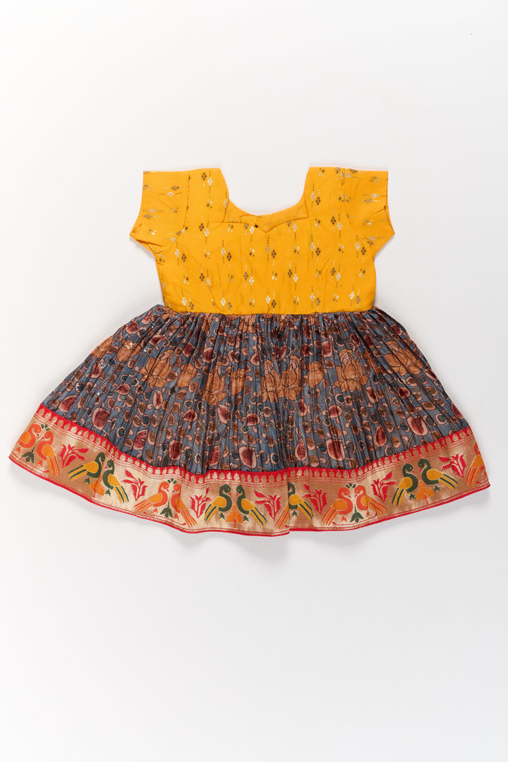 The Nesavu Silk Frock Girls Yellow Pattu Pavadai with Traditional Printed Border and Contrast Skirt for Festive Wear Nesavu 14 (6M) / Yellow SF958A-14 Nesavu Girls Yellow Pattu Pavadai Traditional Printed Border Contrast Skirt Festive Occasions