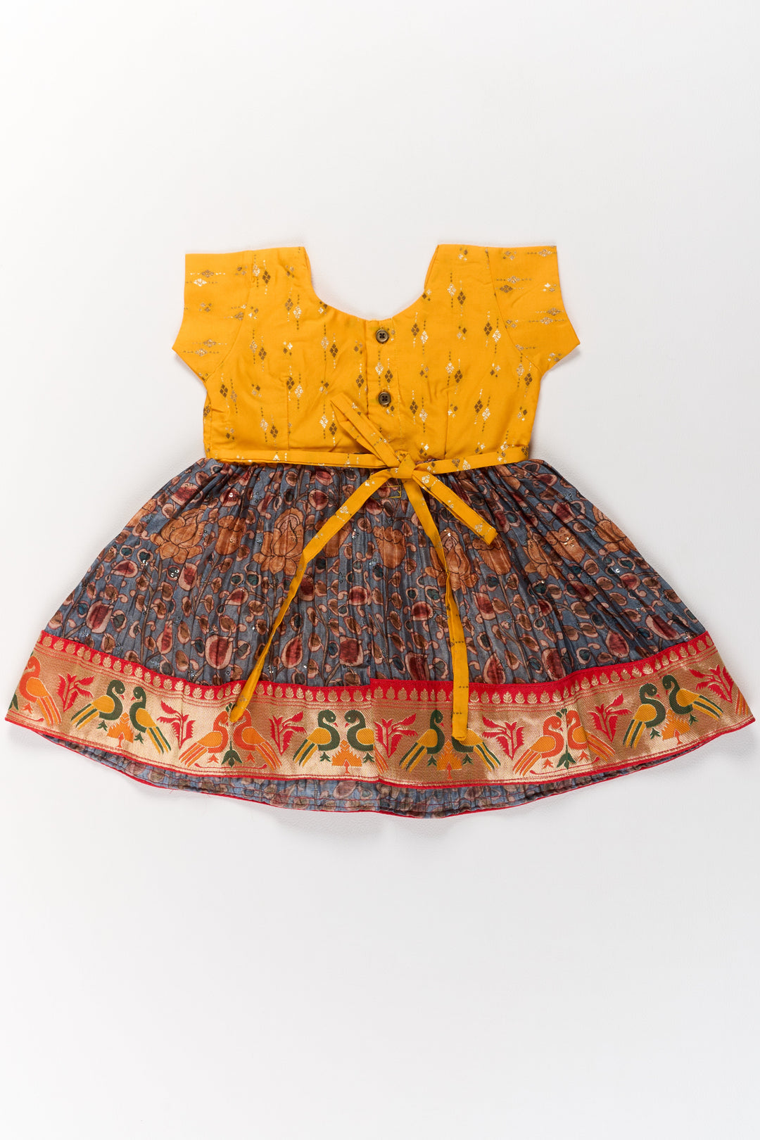The Nesavu Silk Frock Girls Yellow Pattu Pavadai with Traditional Printed Border and Contrast Skirt for Festive Wear Nesavu Nesavu Girls Yellow Pattu Pavadai Traditional Printed Border Contrast Skirt Festive Occasions