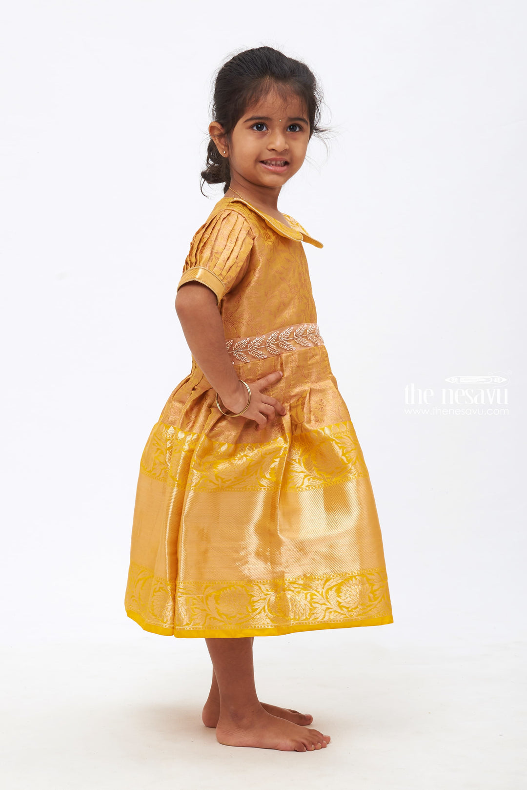 The Nesavu Silk Frock Golden Gleam Delight: Stone & Bead Embellished Silk Frock for Girls Nesavu Golden Gleam Delight Silk Frock for Girls |