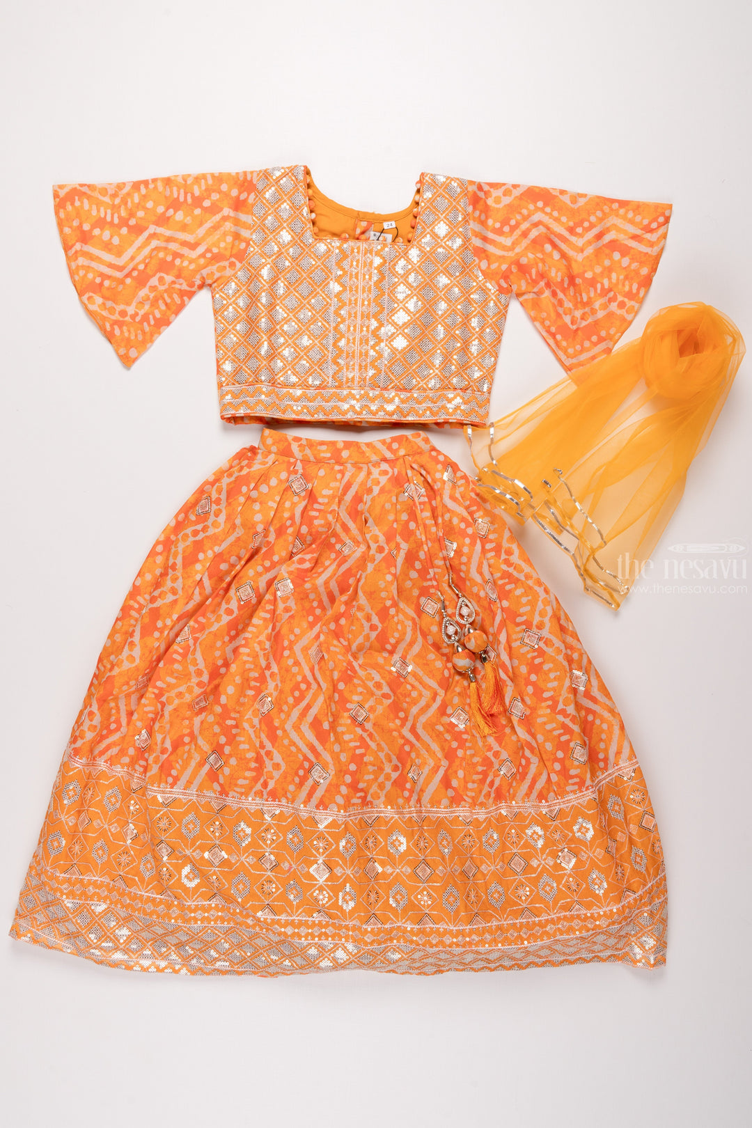 The Nesavu Girls Lehenga Choli Golden Radiance: Exquisite Patterned Orange Lehenga Choli for Girls Nesavu Diwali Princess | Traditional Lehenga Choli Sets for Girls | The Nesavu