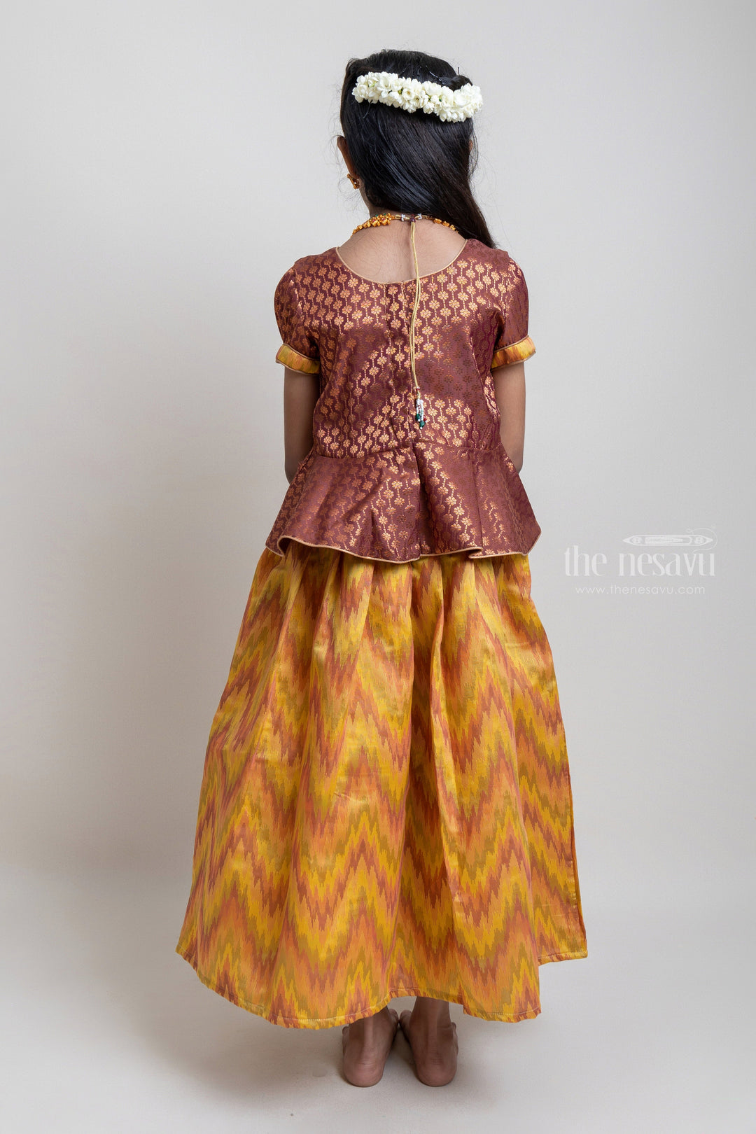 The Nesavu Pattu Pavadai Gorgeous Brown Floral Designed Silk Blouse With Ziz-Zag Pattu Pavadai For Girls Nesavu Traditional Wear For Girls | Latest Pattu Pavadai | The Nesavu