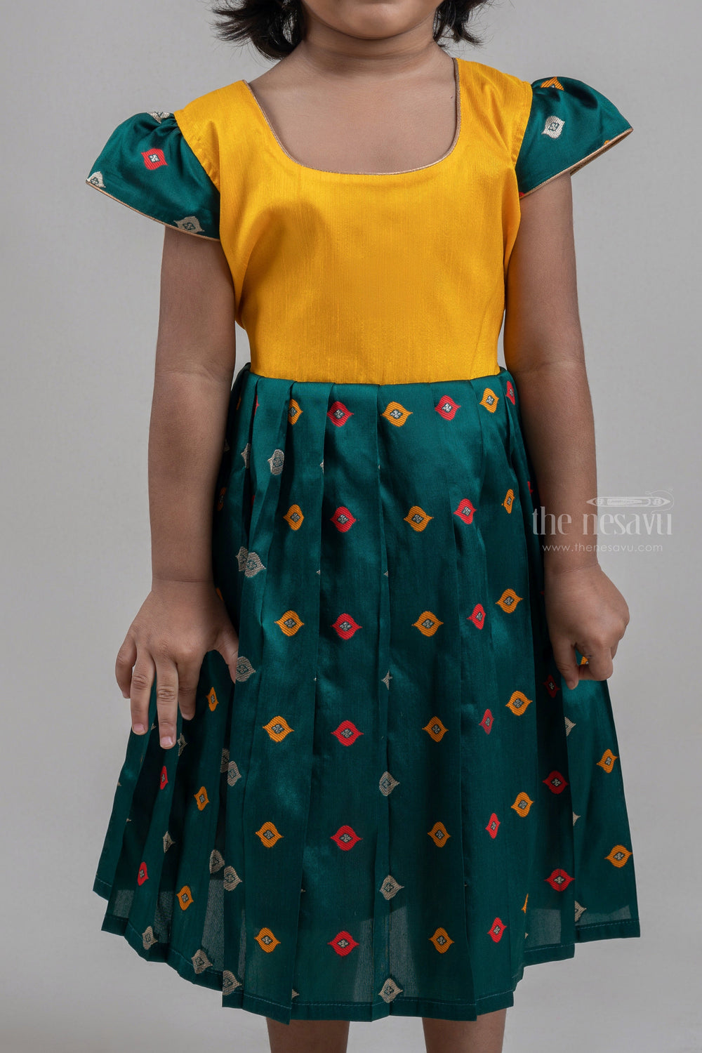 The Nesavu Silk Frock Gorgeous Yellow Yoke And Green Pleated Butta Printed Semi-Silk frock For Girls Nesavu Latest Festive Silk Wear Frock For Girls | Silk Frock Collection | The Nesavu