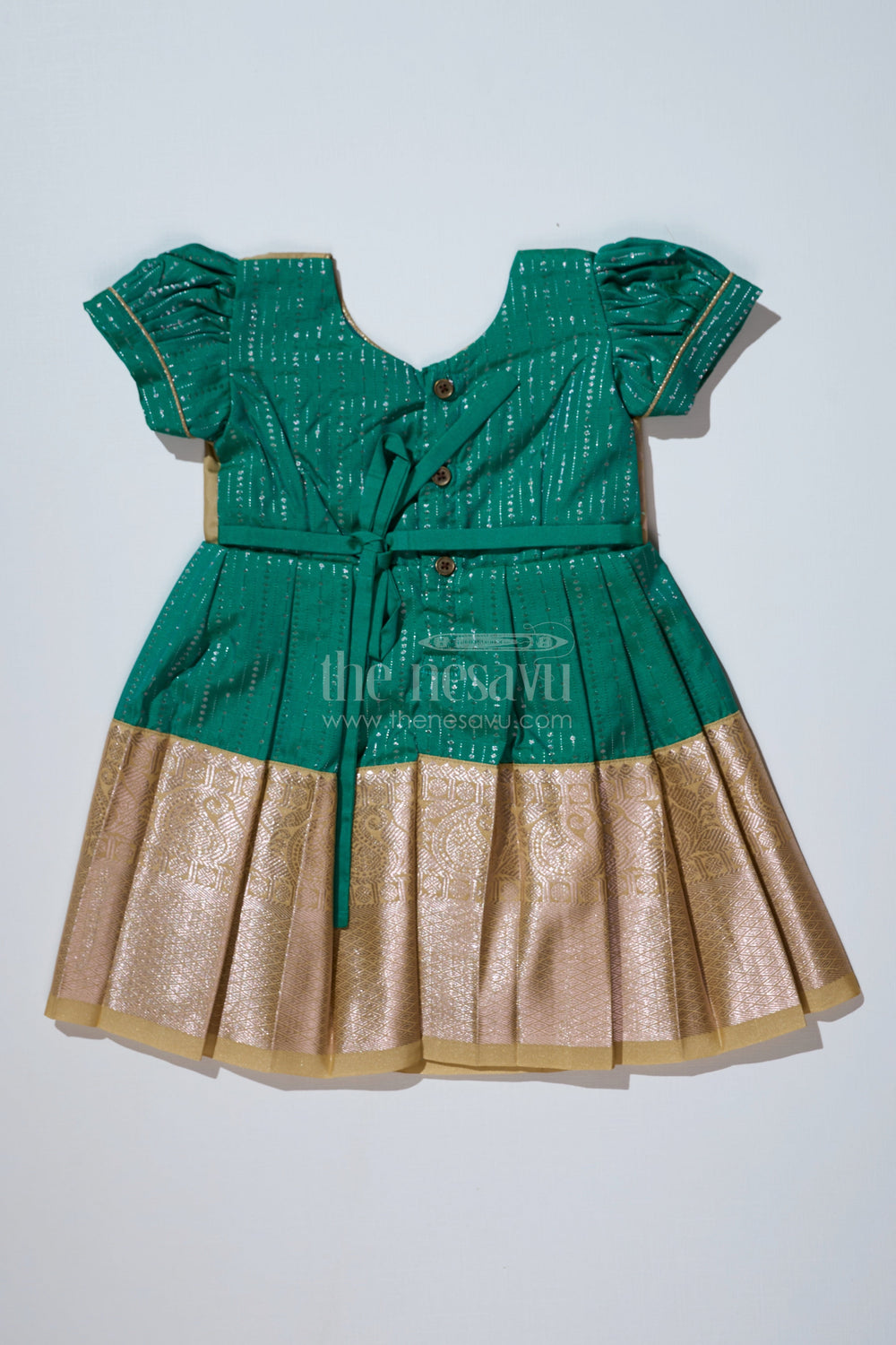 The Nesavu Girls Kanchi Silk Frock Graceful Green Silk Dress for Girls with Kanchipuram Inspired Fabric and Gold Zari Pleated Border Nesavu Nesavu Green Silk Dress Girls Kanchipuram Inspired Fabric Gold Zari Pleated Border