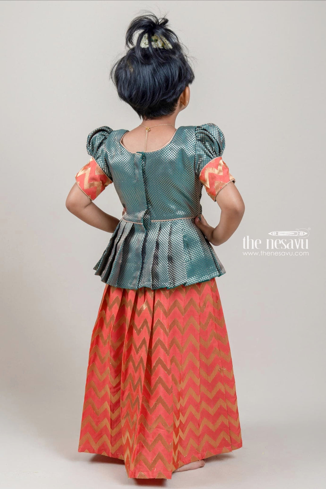 The Nesavu Pattu Pavadai Green Brocade Designer Silk Blouse with salmon Pink Silk Skirt for Girls Nesavu Green Brocade Silk Blouse with Salmon Pink Silk Skirt | Traditional Pattu Pavadai |The Nesavu