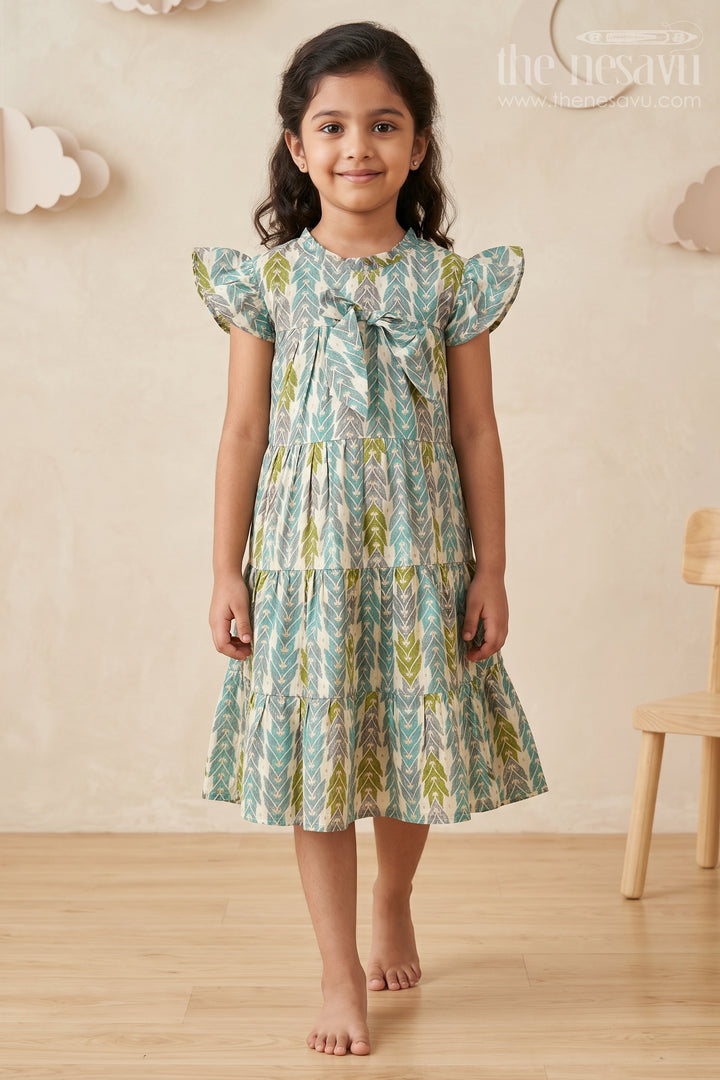 The Nesavu Girls Cotton Frock Green Colour Frock for Girls in Modal Silk with Multicolor Geometric Print and Front Bow Design Nesavu 18 (2Y) / Green GFC1696B-18 Green Colour Frock Girls Modal Silk Multicolor Geometric Print Front Bow | The Nesavu
