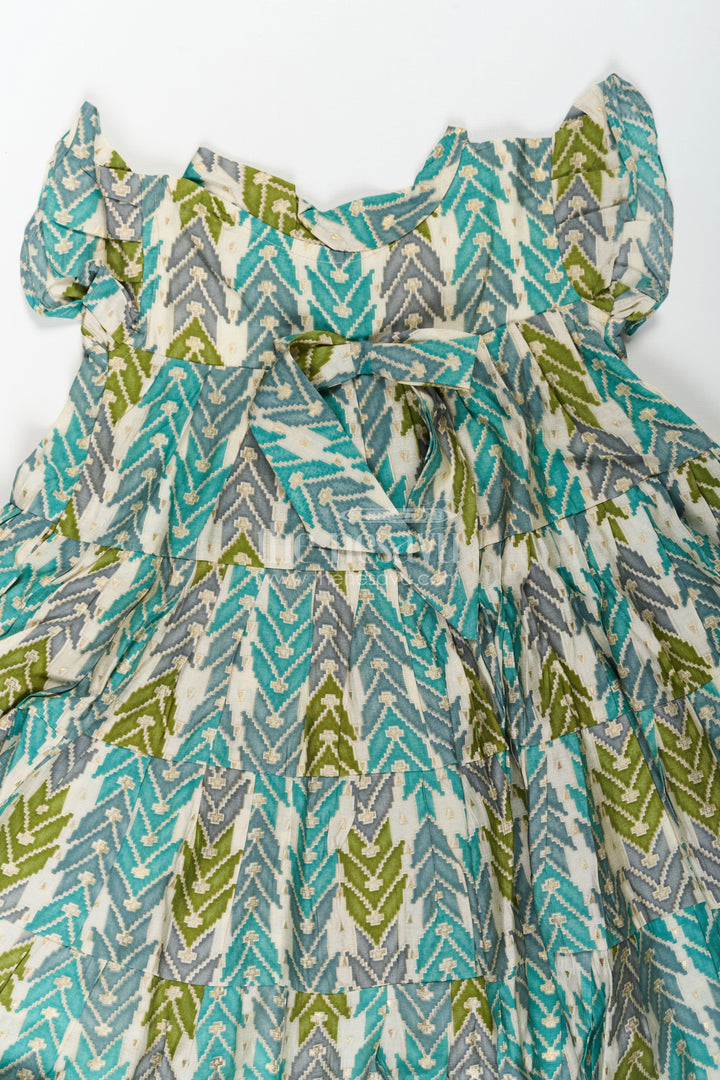 The Nesavu Girls Cotton Frock Green Colour Frock for Girls in Modal Silk with Multicolor Geometric Print and Front Bow Design Nesavu Nesavu Green Colour Frock Girls Modal Silk Multicolor Geometric Print Front Bow