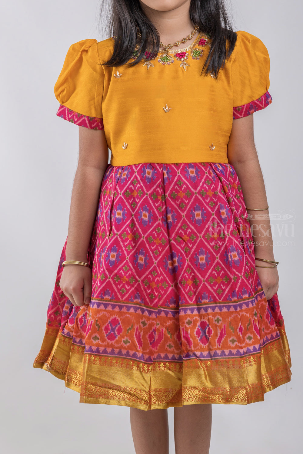 The Nesavu Silk Party Frock Ikkat Printed and Floral Embroidered Yellow Banarasi Silk Frock For Girls psr silks Nesavu