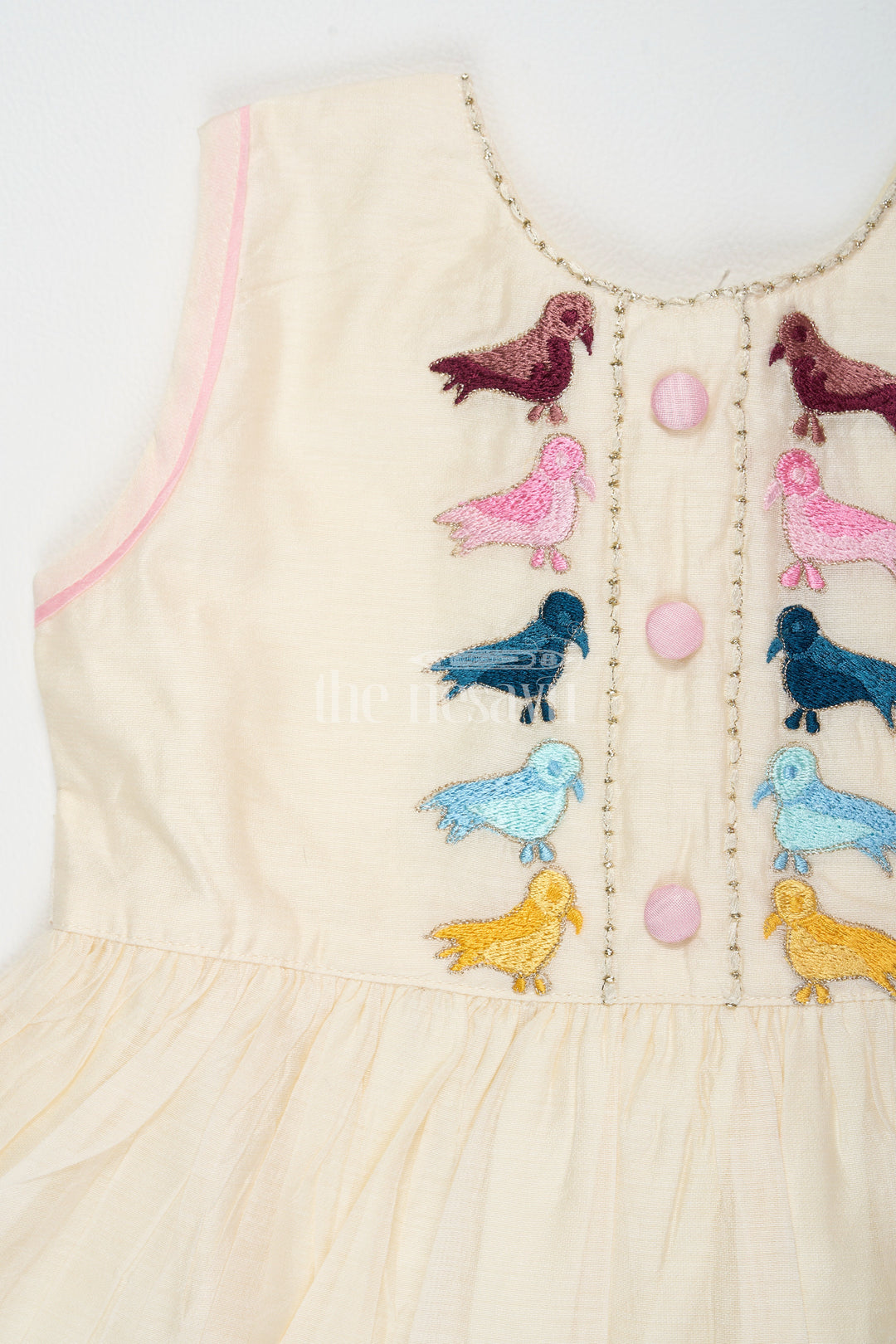 The Nesavu Girls Cotton Frock Ivory Chanderi Cotton Frock for Girls with Colorful Bird Embroidery and Pink Trim Nesavu Nesavu Girls Ivory Chanderi Cotton Frock Bird Embroidery Pink Hem Trim
