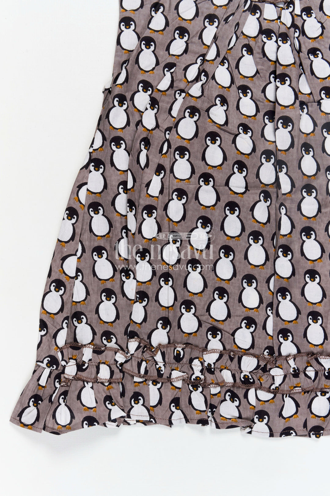 The Nesavu Girls Cotton Frock Kids Casual Cotton Printed Frock for Girls with Brown Penguin Block Print and Frilled Shoulders Nesavu Nesavu Brown Hand Block Kids Casual Cotton Printed Frock Penguin Motifs Ruffled Design