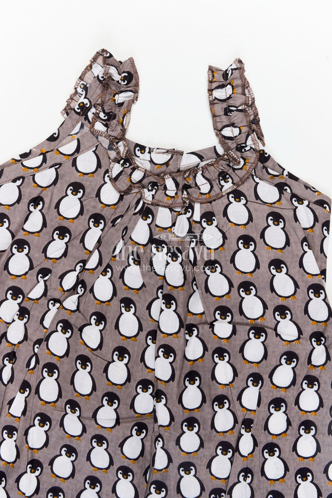 The Nesavu Girls Cotton Frock Kids Casual Cotton Printed Frock for Girls with Brown Penguin Block Print and Frilled Shoulders Nesavu Nesavu Brown Hand Block Kids Casual Cotton Printed Frock Penguin Motifs Ruffled Design