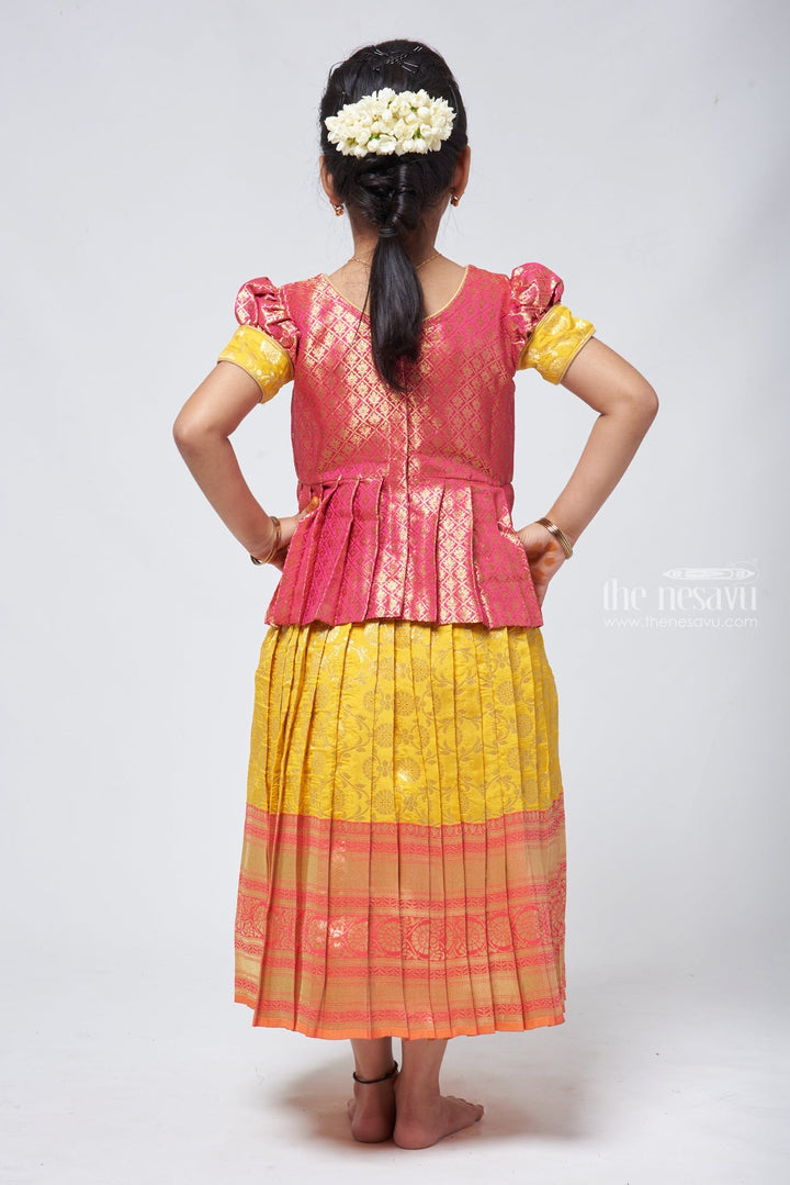 The Nesavu Pattu Pavadai Langa Brocade Peplum Blouse paired with Banarasi Pattu Pavadai Chattai - Traditional Silk Dress for Girls Nesavu Traditional Girls Pavadai Sattai | Langa Voni Pattu Pavadai For Girls | The Nesavu