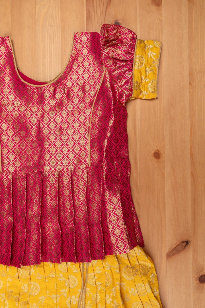 The Nesavu Pattu Pavadai Langa Brocade Peplum Blouse paired with Banarasi Pattu Pavadai Chattai - Traditional Silk Dress for Girls Nesavu Traditional Girls Pavadai Sattai | Langa Voni Pattu Pavadai For Girls | The Nesavu