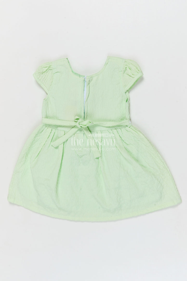 The Nesavu Girls Cotton Frock Lightweight Cotton Frock for Baby Girls' Everyday Moments Nesavu Nesavu seersucker baby frock with pastel flower detail and puff sleeves for everyday comfort