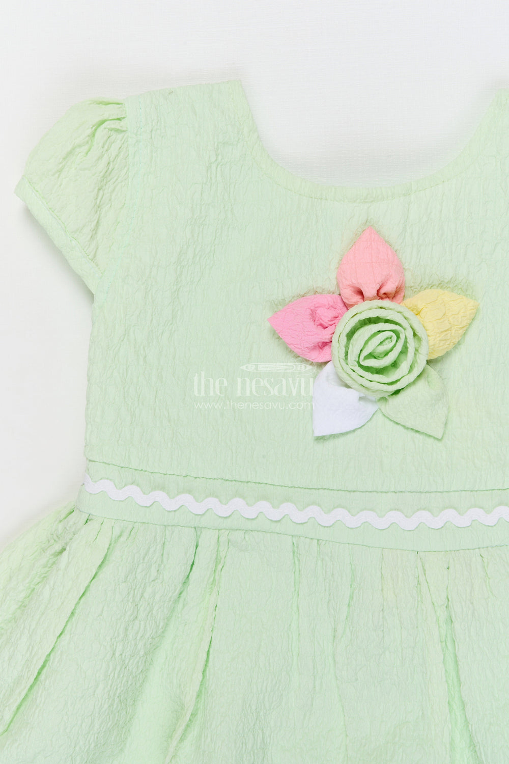 The Nesavu Girls Cotton Frock Lightweight Cotton Frock for Baby Girls' Everyday Moments Nesavu Nesavu seersucker baby frock with pastel flower detail and puff sleeves for everyday comfort