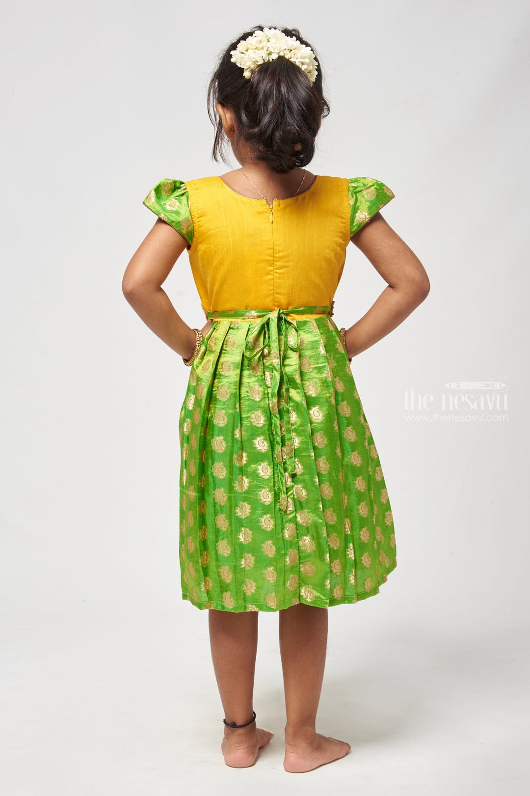 The Nesavu Silk Frock Lush Green Butta Dream Pleated Pattu Brilliance for Girls. Nesavu Latest Green Dresigner Silk Frock For Girls | Premium Silk Frock | The Nesavu