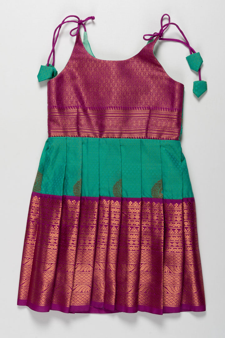 The Nesavu Tie-up Frock Majestic Peacock Silk Tie-Up Frock: A Fusion of Splendor for Annaprasana and Vidyarambham Nesavu 18 (2Y) / Green / Style 1 T372B-18 Shop Elegant Silk TieUp Frocks for Girls | Floral Print Silk Dresses Online | The Nesavu
