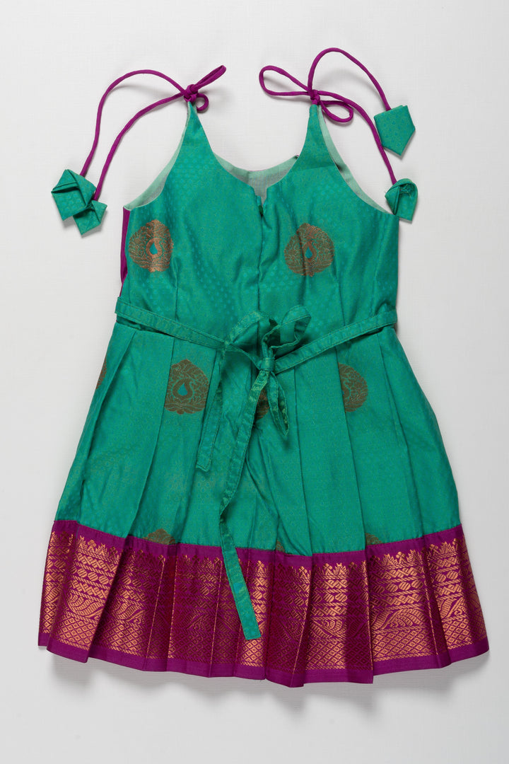The Nesavu Tie-up Frock Majestic Peacock Silk Tie-Up Frock: A Fusion of Splendor for Annaprasana and Vidyarambham Nesavu Shop Elegant Silk TieUp Frocks for Girls | Floral Print Silk Dresses Online | The Nesavu