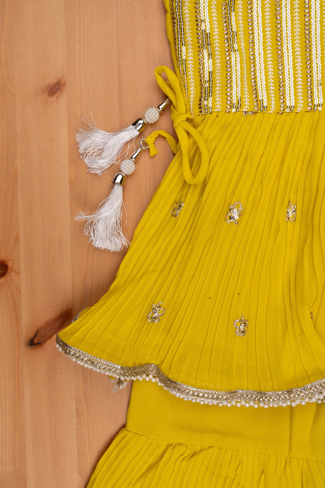 The Nesavu Sets & Suits Majestic Zari Embroidered Yellow Peplum Kurti with Palazzo Suit: Indian Traditional Flair. Nesavu Majestic Zari Embroidered Yellow Peplum Kurti with Palazzo Suit: Indian Traditional Flair