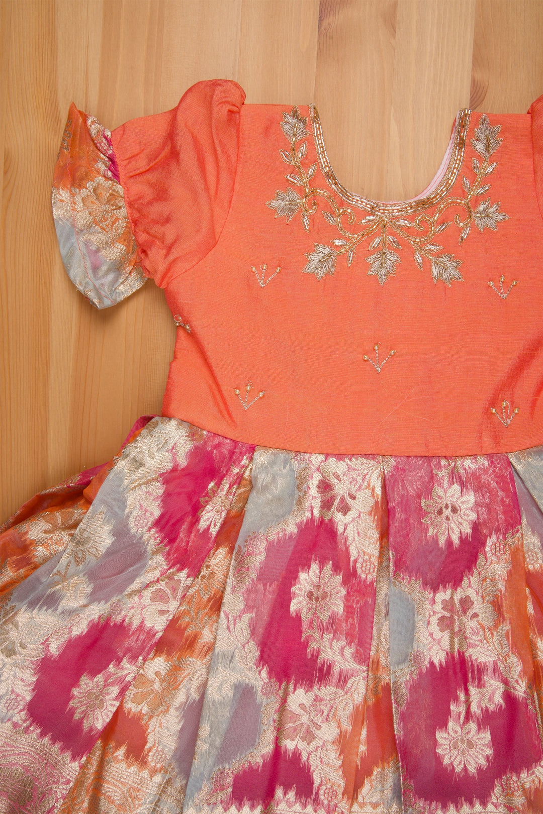 The Nesavu Silk Party Frock Mesmerizing Zari Embroidery on Pleated Kanchivaram Orange Ensemble Nesavu Pattu Frock For Little Girls | Girls Designer Silk Frock | The Nesavu