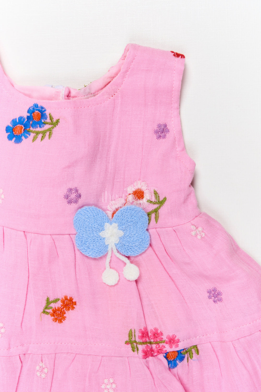 The Nesavu Baby Cotton Frocks Muslin Cotton Frock for Baby Girl’s Playdates and Summer Wear Nesavu Nesavu muslin cotton frock with embroidery and butterfly patch for baby girl’s casual summer days