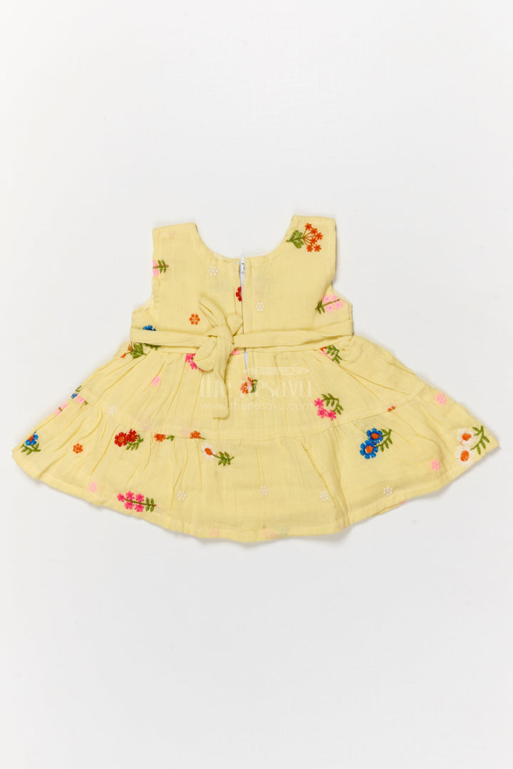 The Nesavu Baby Cotton Frocks Muslin Cotton Frock for Baby Girl's Summer Playdates and Casual Wear Nesavu 14 (6M) / Yellow / Cotton Blend BFJ910B-14 Nesavu muslin cotton frock with floral embroidery and butterfly patch for baby girl summer wear