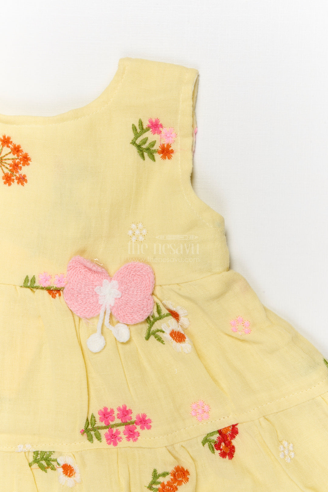 The Nesavu Baby Cotton Frocks Muslin Cotton Frock for Baby Girl's Summer Playdates and Casual Wear Nesavu Nesavu muslin cotton frock with floral embroidery and butterfly patch for baby girl summer wear