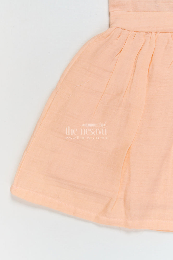 The Nesavu Girls Cotton Frock Muslin Cotton Frock for Baby Girls’ Everyday Comfort Nesavu Nesavu muslin cotton baby frock for everyday wear with ruffle sleeves and floral applique