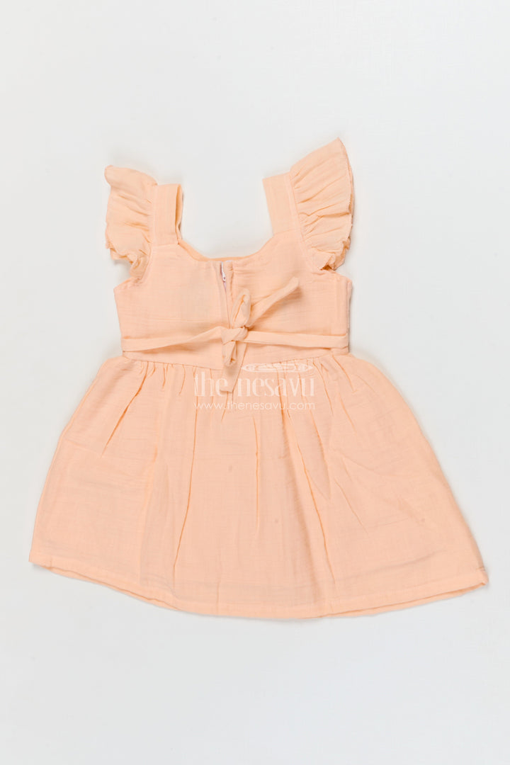 The Nesavu Girls Cotton Frock Muslin Cotton Frock for Baby Girls’ Everyday Comfort Nesavu Nesavu muslin cotton baby frock for everyday wear with ruffle sleeves and floral applique