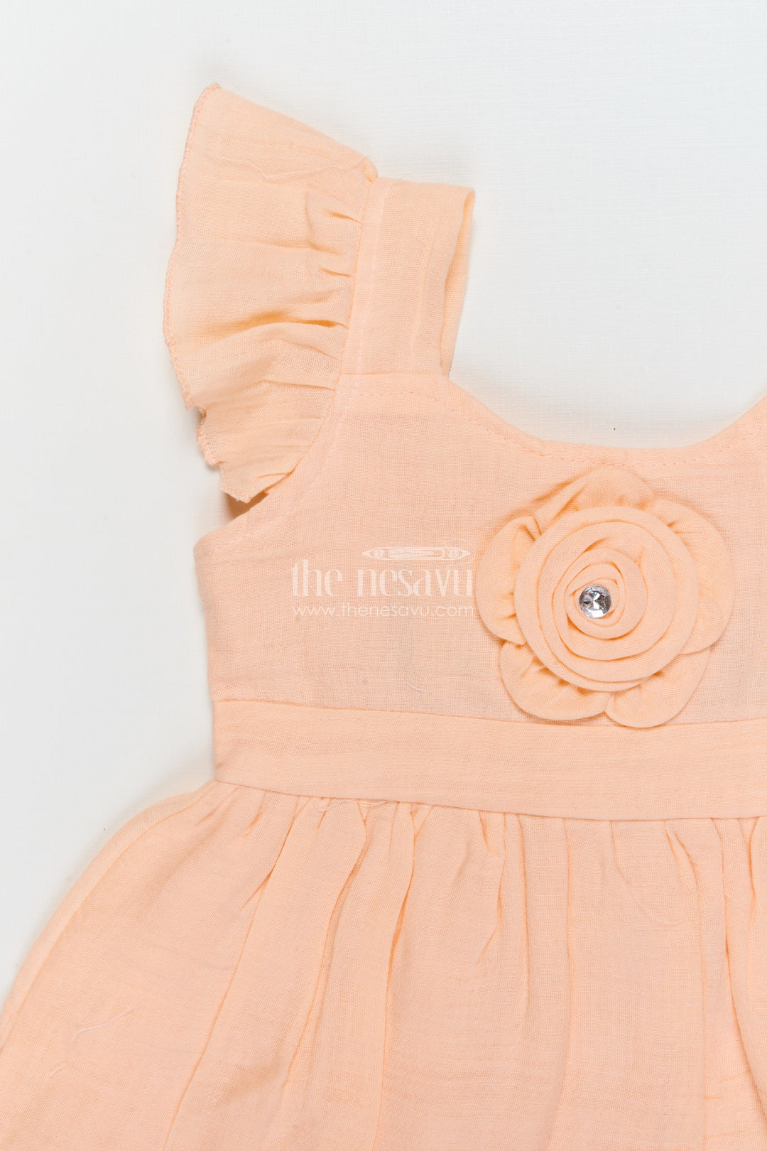 The Nesavu Girls Cotton Frock Muslin Cotton Frock for Baby Girls’ Everyday Comfort Nesavu Nesavu muslin cotton baby frock for everyday wear with ruffle sleeves and floral applique