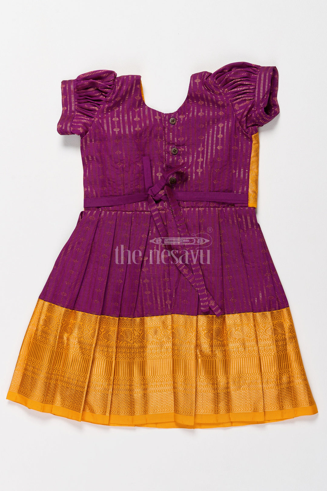 The Nesavu Girls Kanchi Silk Frock Mustard Yellow Girls Kanchi Pongal Dress with Brocade Accents and Zari Borders Nesavu Nesavus Mustard Yellow Kanchi Silk Pongal Dress Brocade Yoke Zari Borders