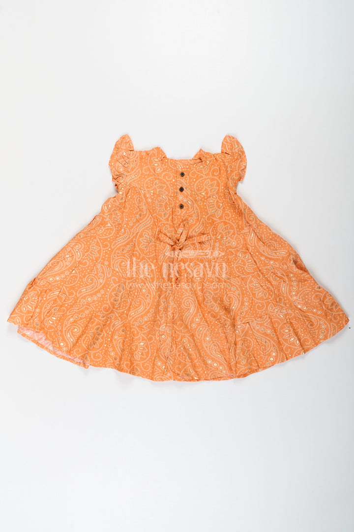 The Nesavu Girls Cotton Frock Nesavu Casual Cotton Frocks for Girls in Rayon with Orange Bandhani Print and Gold Foil Details Nesavu Nesavu Casual Cotton Frocks Girls Rayon Orange Bandhani Print Gold Foil Details