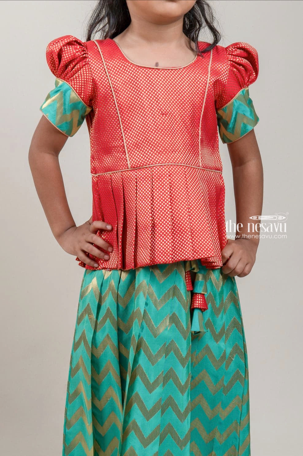 The Nesavu Pattu Pavadai Orange Brocade Designer Silk Blouse with Green Silk Skirt for Girls Nesavu Orange Brocade Silk Blouse with Green Silk Skirt | Traditional Pattu Pavadai |The Nesavu