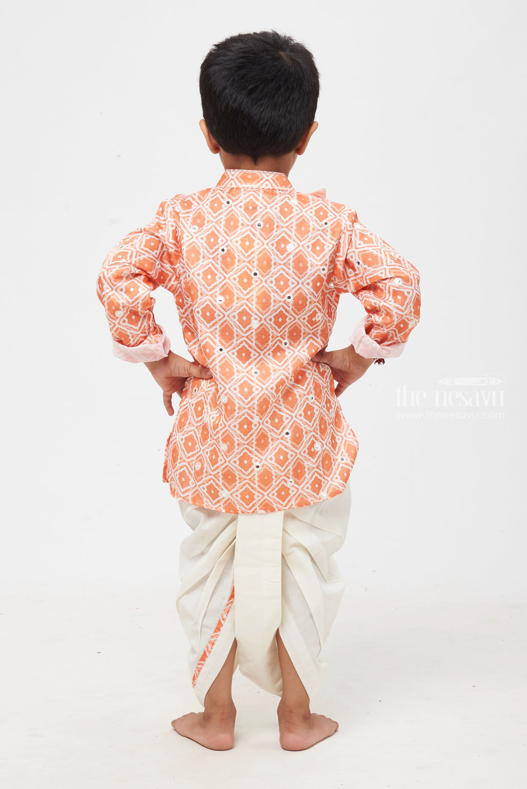 The Nesavu Boys Dothi Set Orange Radiance: Mirror-Embroidered Geometric Printed Kurta & Panjagacham Set for Boys Nesavu Classic Boys Kurta and Dhoti Combo | Timeless Panchagajam Styles | The Nesavu