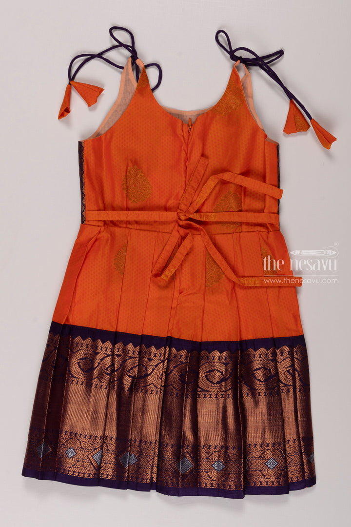 The Nesavu Tie-up Frock Orange Silk Tie-Up Frock with Traditional Accents for Girls Nesavu Elegant Orange Silk Frock for Girls | Ethnic Border Design | Kids Festive Wear | The Nesavu