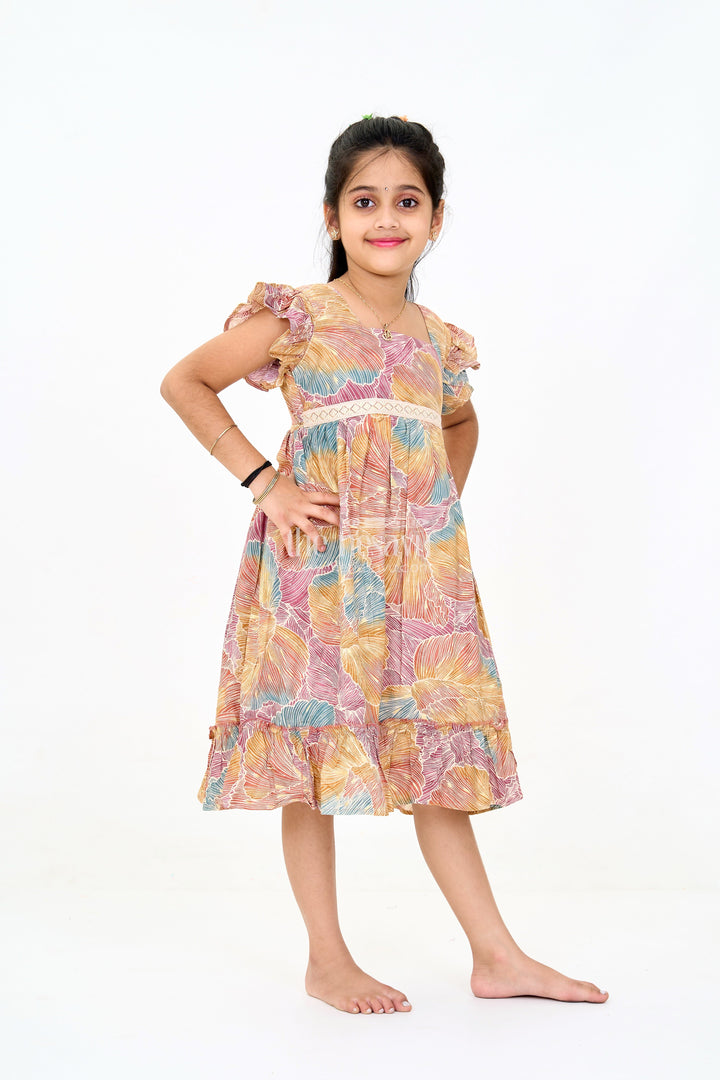 The Nesavu Girls Cotton Frock Organza Frock for Girls in Multicolor Leaf Pattern with Flared Design Nesavu Nesavu Multicolor Leaf Pattern Organza Frock Girls Ruffle Hem