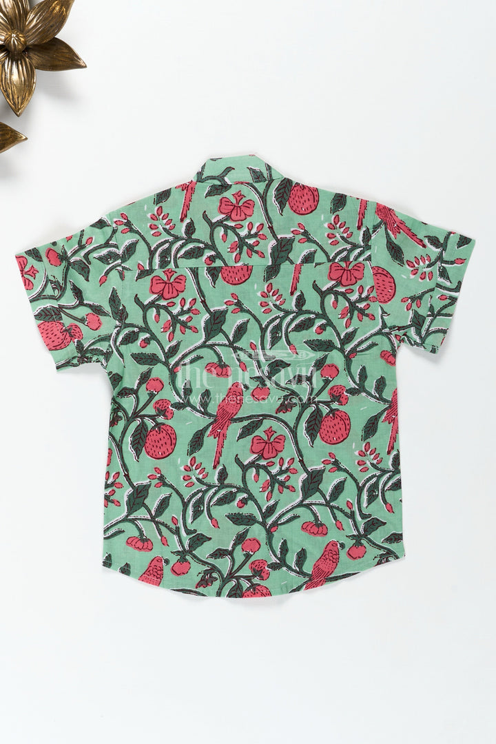 The Nesavu Boys Cotton Shirt Parrot and Botanical Print Boys Cotton Shirt Natureinspired Green Casual Wear Nesavu Nesavu Nature Inspired Green Cotton Shirt Boys Parrot Leaf Print Design Summer Days