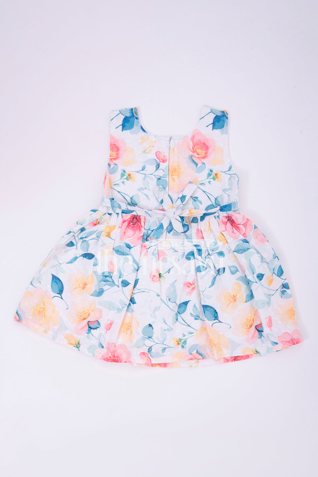 The Nesavu Girls Cotton Frock Peach Floral Sleeveless Baby Frock Nesavu 14 (6M) / multicolor BFJ582D-14 Peach Floral Sleeveless Baby Frock with Bow Detail