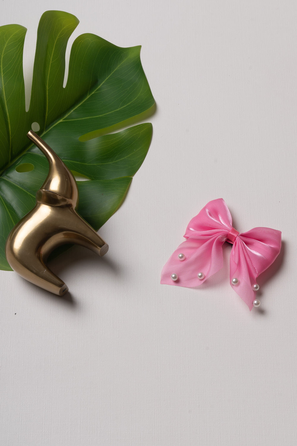 The Nesavu Hair Clip Pearl Accented Pink Satin Bow Hair Clip Nesavu Pink JHCL76G Chic Pink Satin Hair Bow with Pearl Accents | Playful Elegance for Every Occasion | The Nesavu