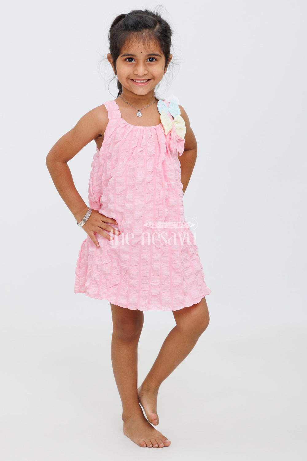 The Nesavu Baby Fancy Frock Pink Baby Frock with Popcorn Fabric and Colorful Bow Accent for Girls Nesavu Pink Baby Frock with Popcorn Fabric and Colorful Bow Accent for Girls Nesavu