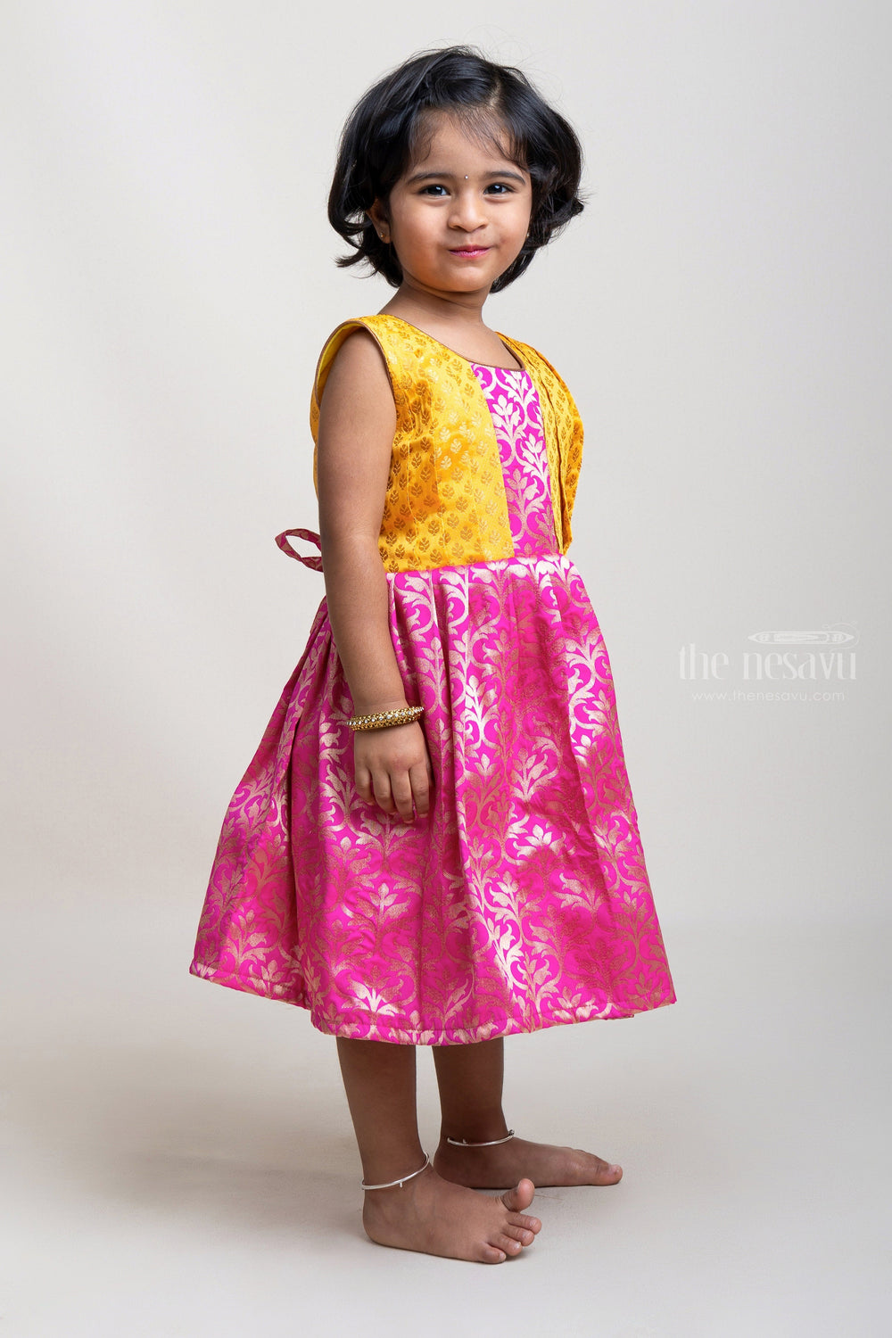 The Nesavu Silk Frock Pink Designer Semi-Silk with Yellow Pleated Yoke Design Frock For Girls Nesavu Stylish Pleated Semi-Silk Frocks for Girls | Premium Silk Frocks | The Nesavu