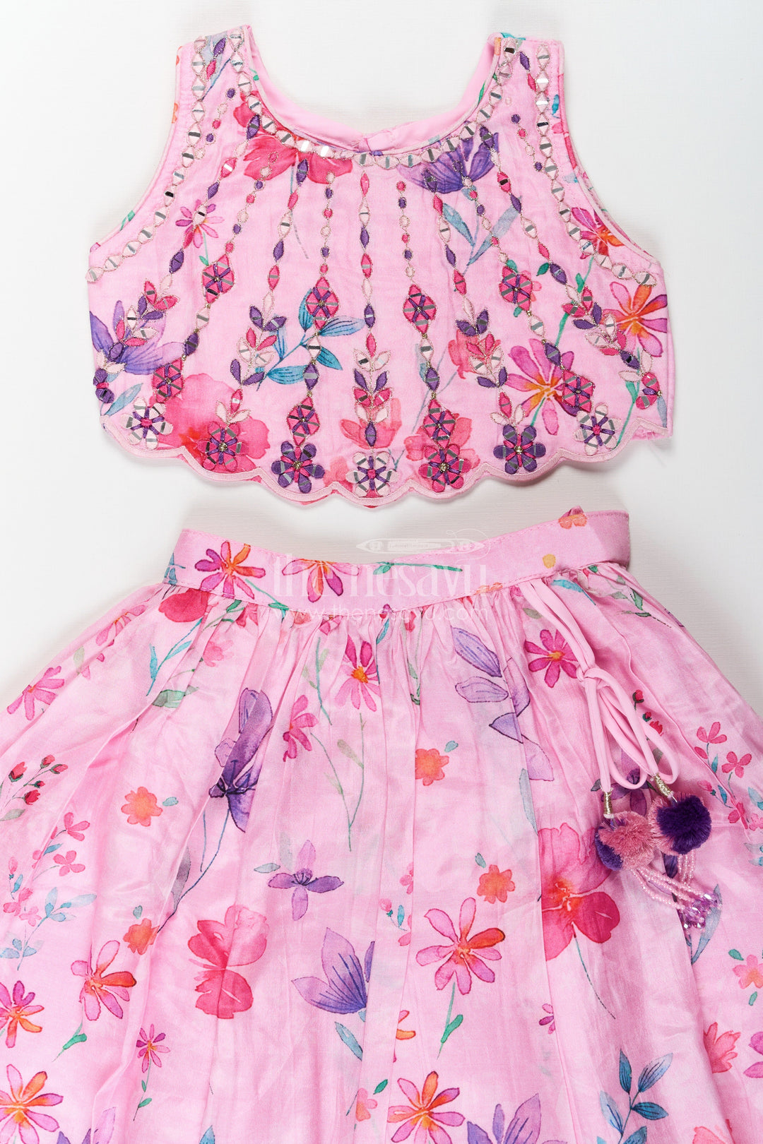 The Nesavu Girls Lehenga Choli Pink Party Wear Lehenga Choli for Girls in Viscose Silk with Mirror Embroidered Yoke and Floral Printed Skirt Nesavu Nesavu Pink Party Wear Girls Lehenga Choli with Floral Print and Mirror Embroidered Viscose Silk Top
