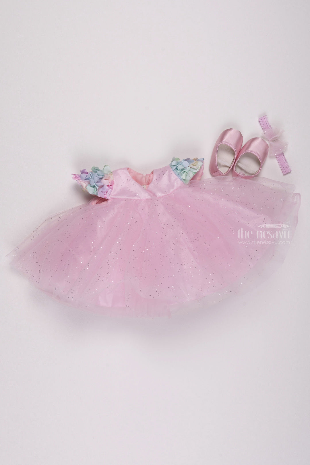 The Nesavu Girls Tutu Frock Pink Perfection: Glittering Net Frock with Delicate Floral Highlights for Girls Nesavu 12 (3M) / Pink / Plain Net PF141B-12 Chic & Trendy: Discover our Baby Girl Party Wear Frocks Collection | The Nesavu