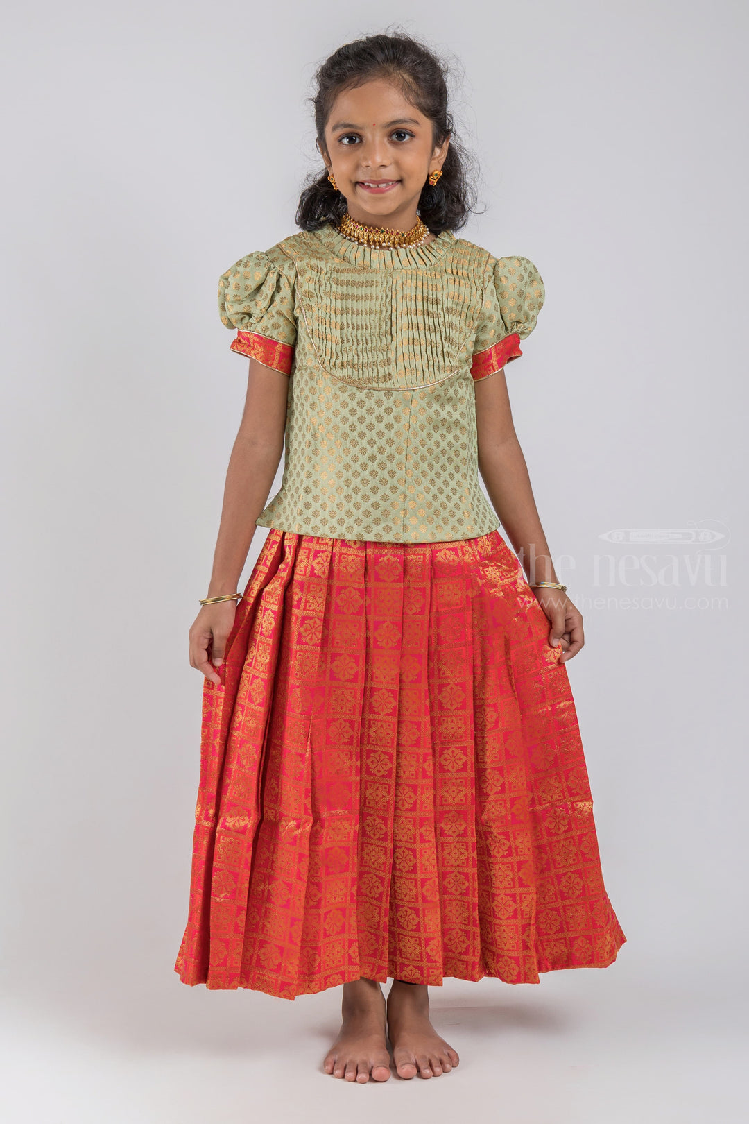 The Nesavu Pattu Pavadai Pretty Lite Green Floral Designer Blouse And Orange Pleated Designer Silk Skirt For Girls psr silks Nesavu 16 (1Y) / Orange / Jacquard GPP259