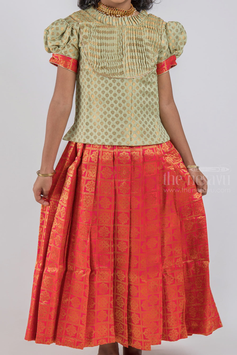 The Nesavu Pattu Pavadai Pretty Lite Green Floral Designer Blouse And Orange Pleated Designer Silk Skirt For Girls psr silks Nesavu