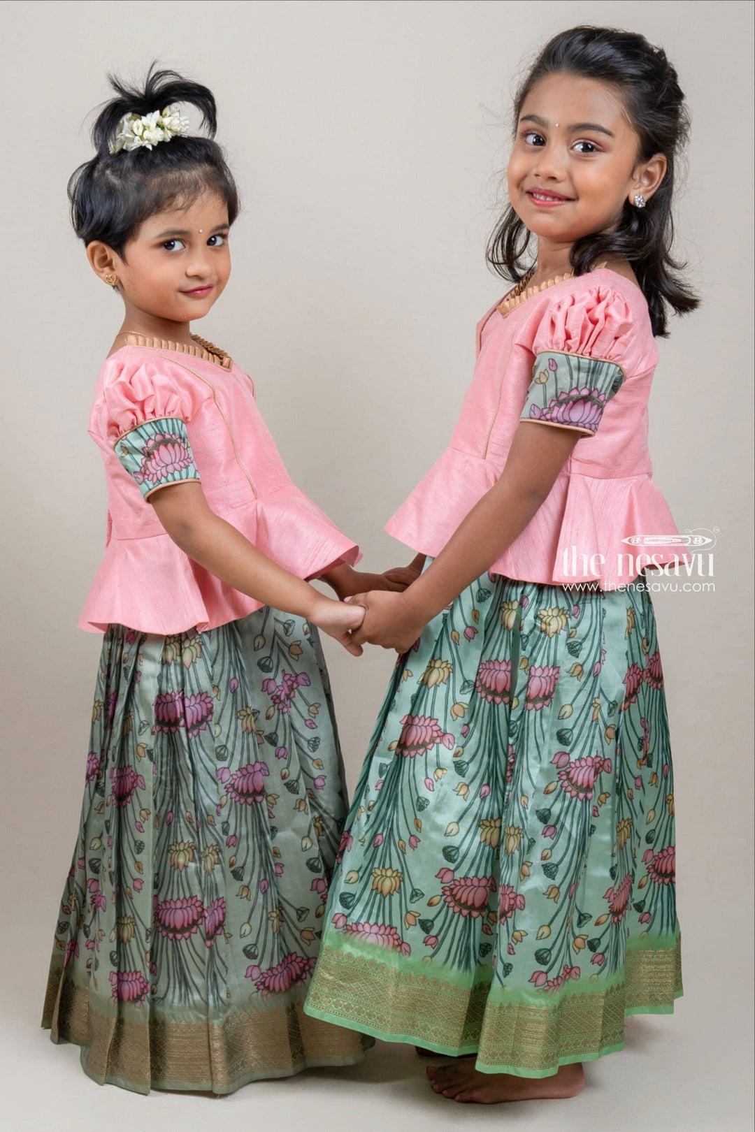 https://www.thenesavu.com/products/nesavu-pretty-salmon-pink-silk-blouse-n-green-floral-printed-pattu-pavadai-for-girls-gpp271b